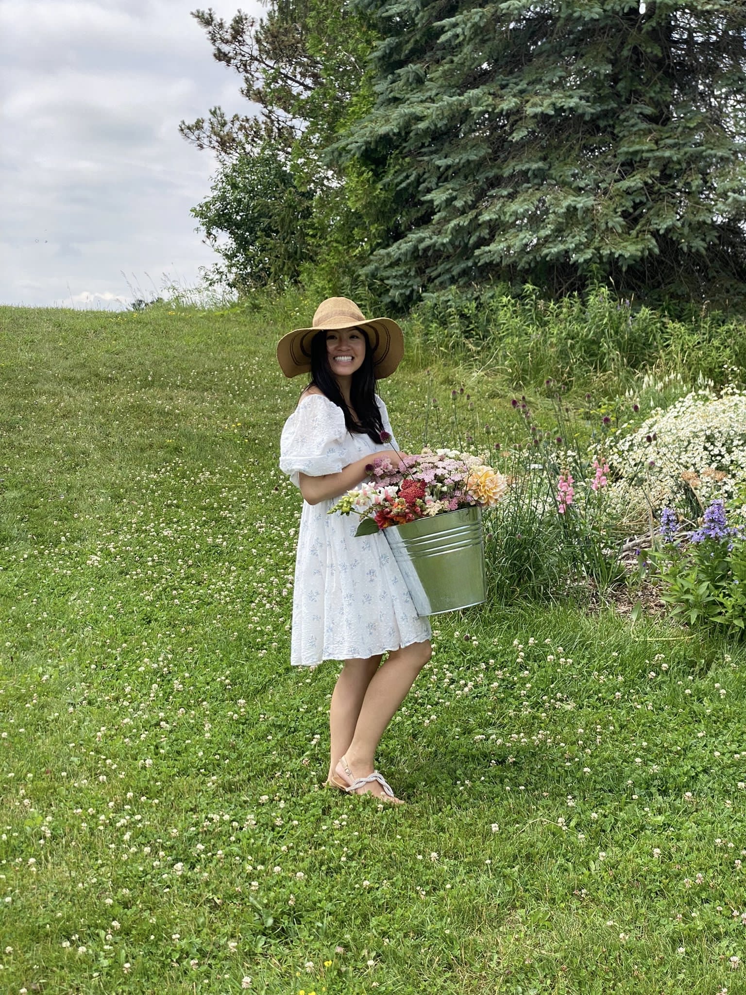Cecile, Creative Partner and co-founder of Golden Hour Blooms Co., arranging wildflowers in Markham, Ontario